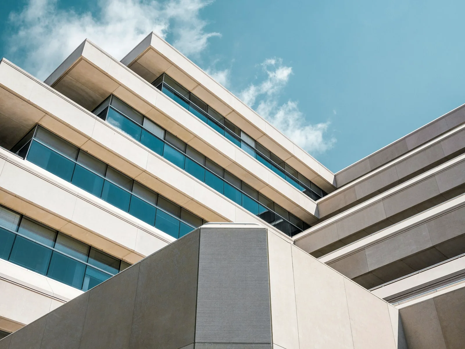 Stacked white balconies in diagonal rhythm